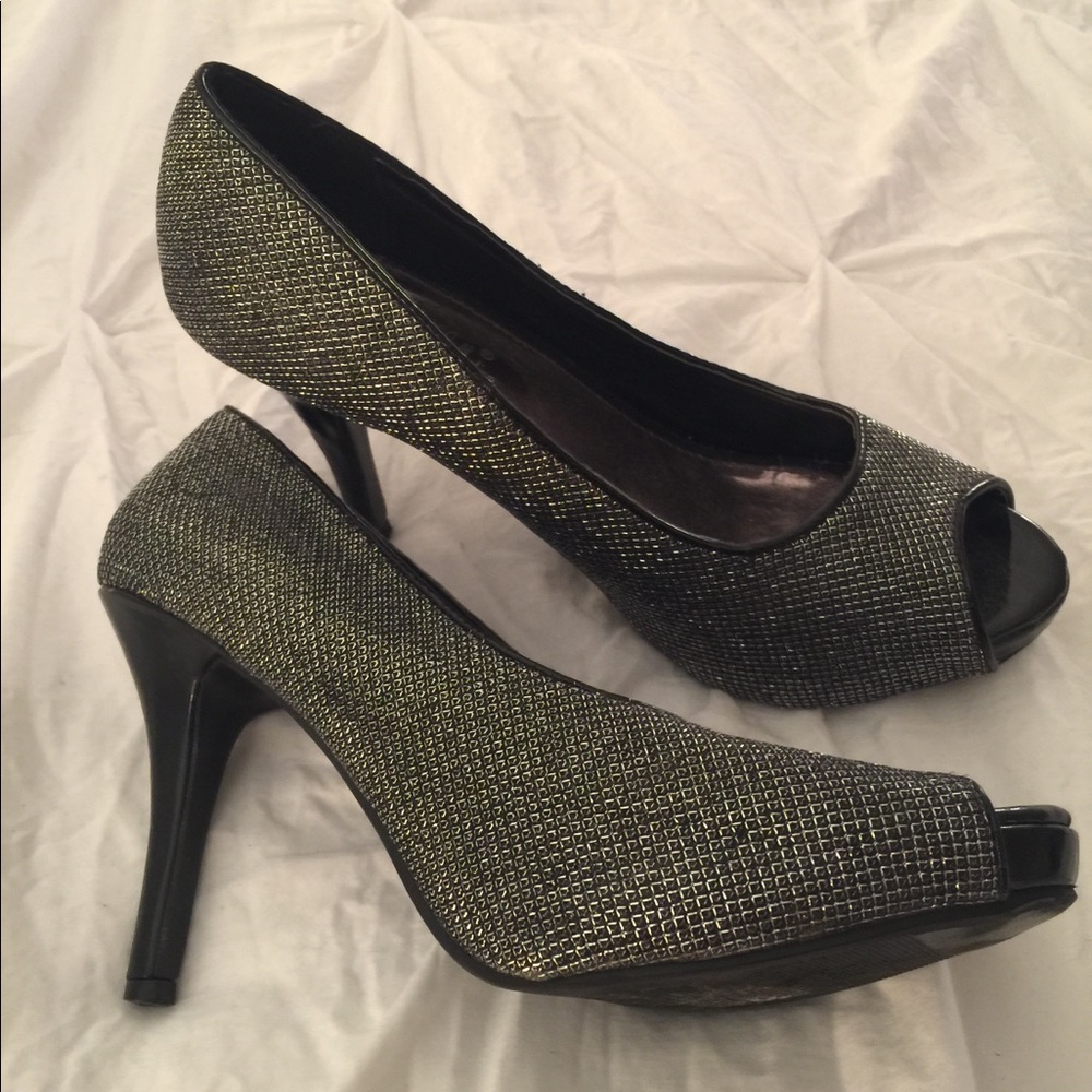 Shimmery silver peep toe heels.